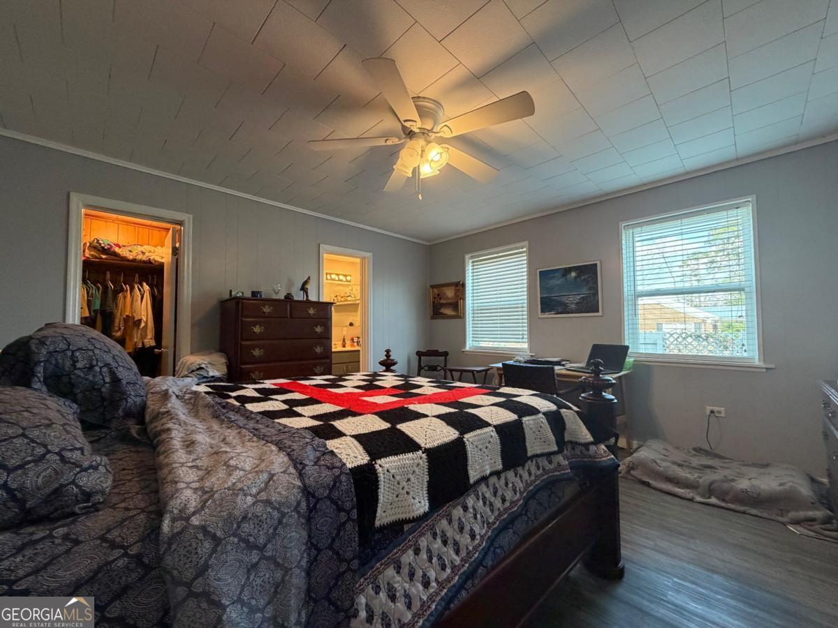 49 North Gill Street Hazlehurst, GA 31539 - Photo 14 of 24 a bedroom with a bed and window