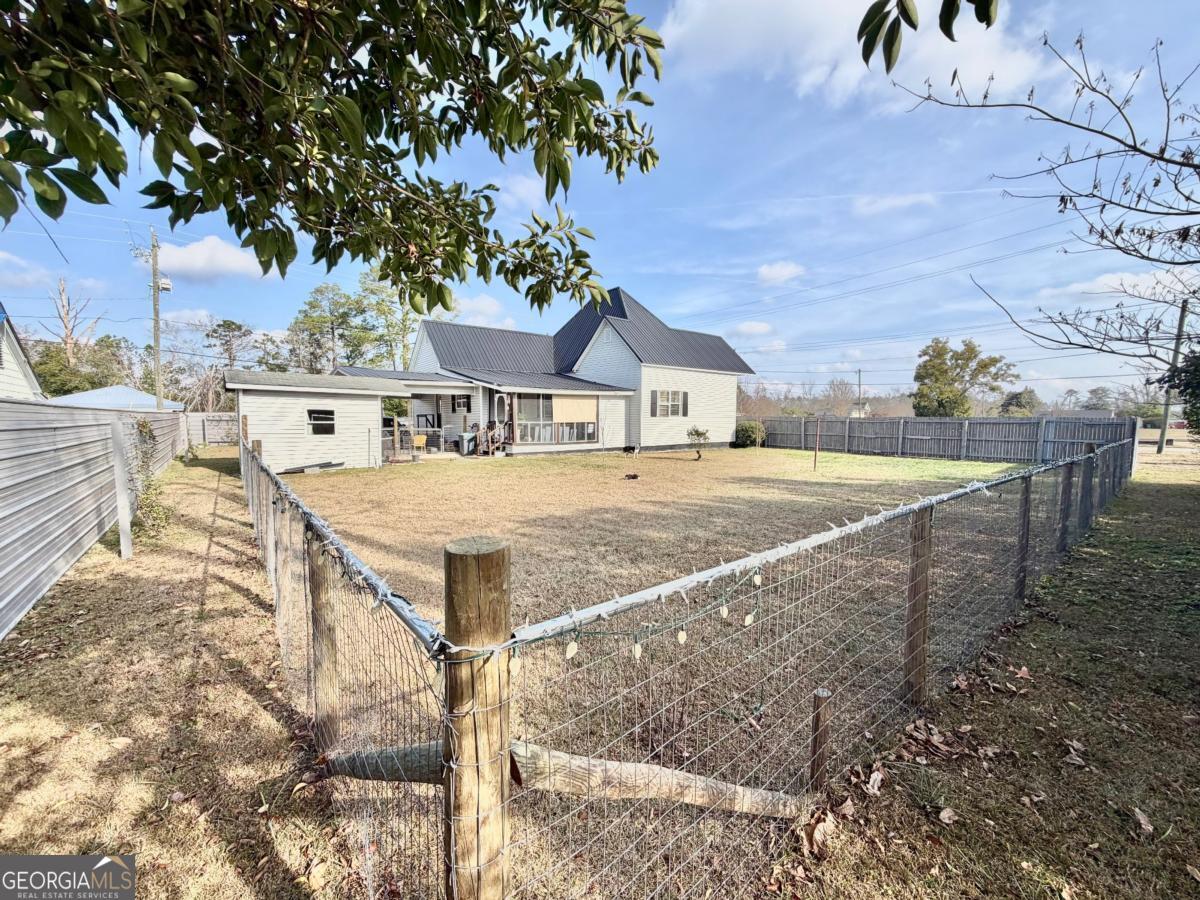 49 North Gill Street Hazlehurst, GA 31539 - Photo 21 of 24 a view of a house with a yard