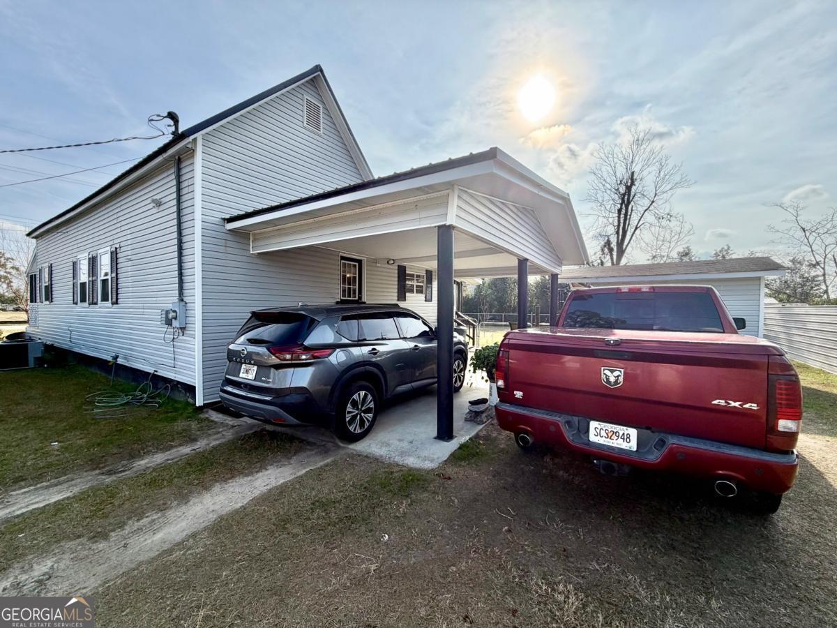 49 North Gill Street Hazlehurst, GA 31539 - Photo 23 of 24 a front view of a house with a garden