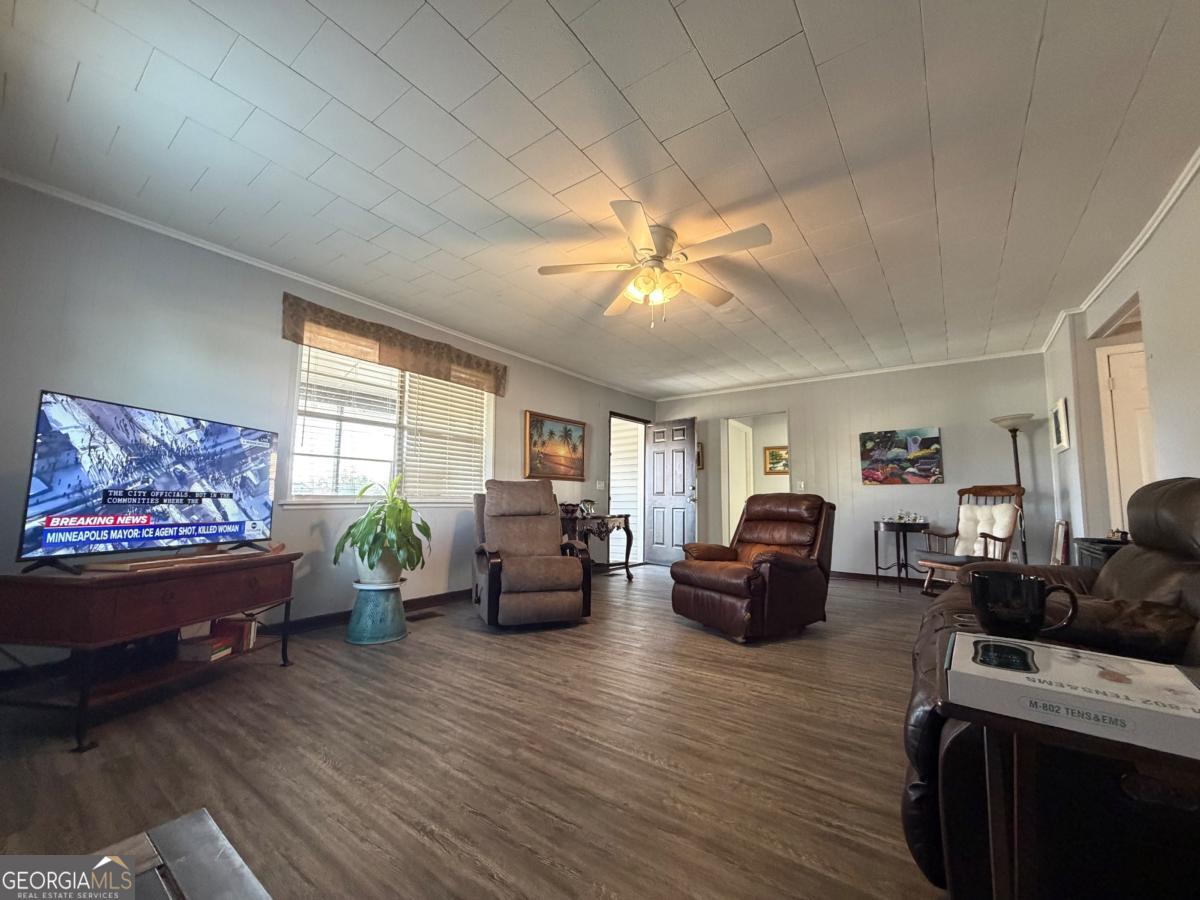 49 North Gill Street Hazlehurst, GA 31539 - Photo 8 of 24 a living room with furniture and a large window