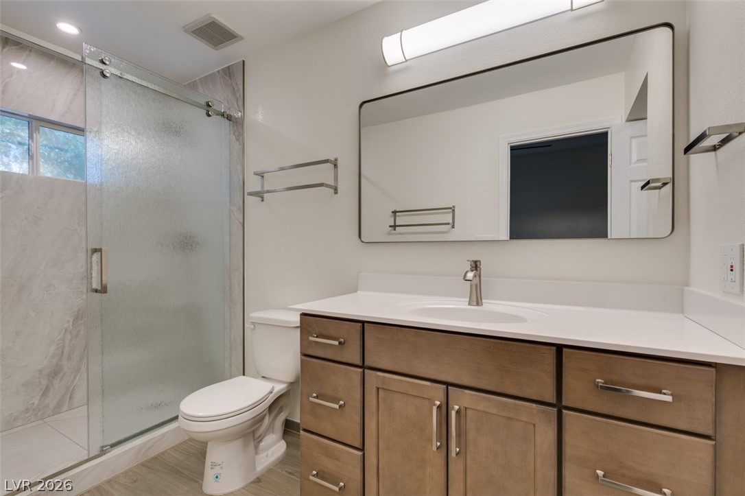 540 Sutters Mill Road Henderson, NV 89014 - Photo 38 of 46 This sleek bathroom features a contemporary vanity with ample storage, a spacious shower, and elegant fixtures.