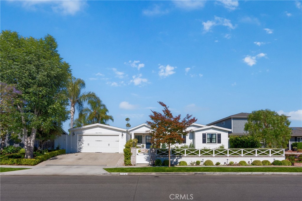 1514 Ruth Lane Newport Beach, CA 92660 - Photo 1 of 1 a front view of multiple houses with yard and green space