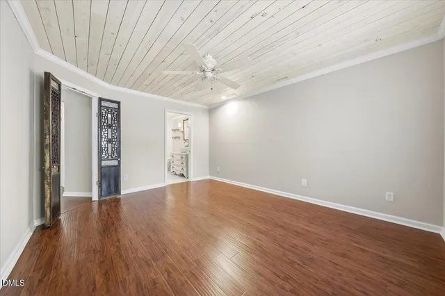 a spacious bathroom with a granite countertop sink a mirror a shower and a bathtub