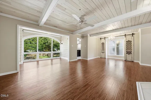a view of a livingroom with wooden floor