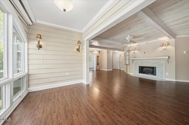a kitchen with stainless steel appliances granite countertop a sink a counter space and a window