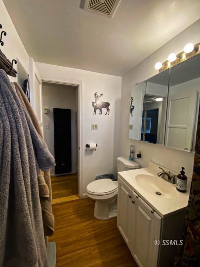 333 North Helena Street Ridgecrest, CA 93555 - Photo 22 of 35 a bathroom with a sink a toilet a mirror and shower