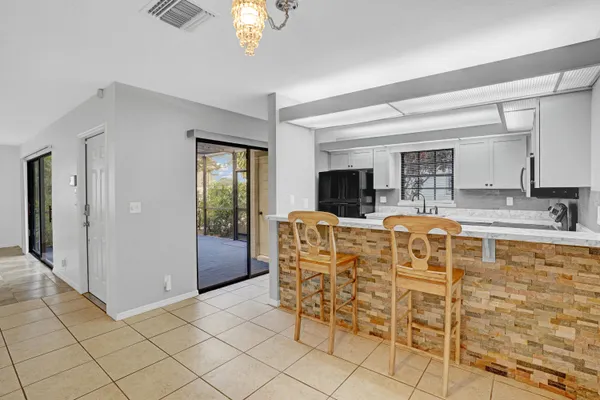 a living room with furniture a dining table and chairs
