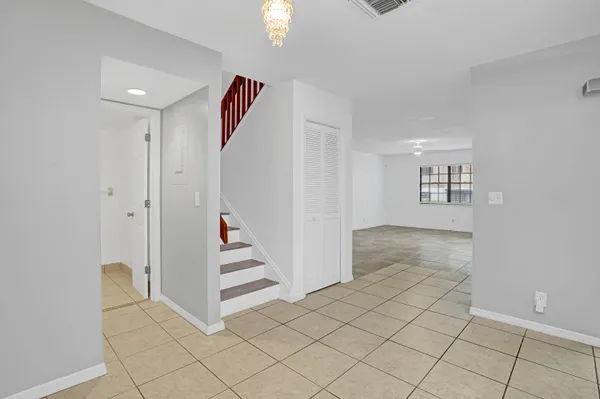 a view of an entryway & staircase