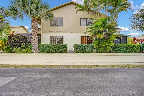 a house with a trees in front of it