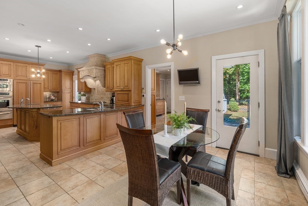7 Turtle Lane Dover, MA 02030 - Photo 14 of 34 a view of a dining room with furniture a chandelier and window