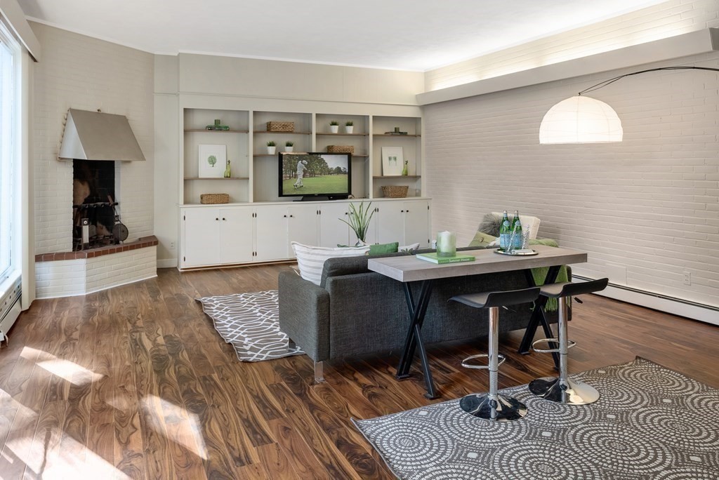 7 Turtle Lane Dover, MA 02030 - Photo 17 of 34 a view of a dining room with a table and chairs