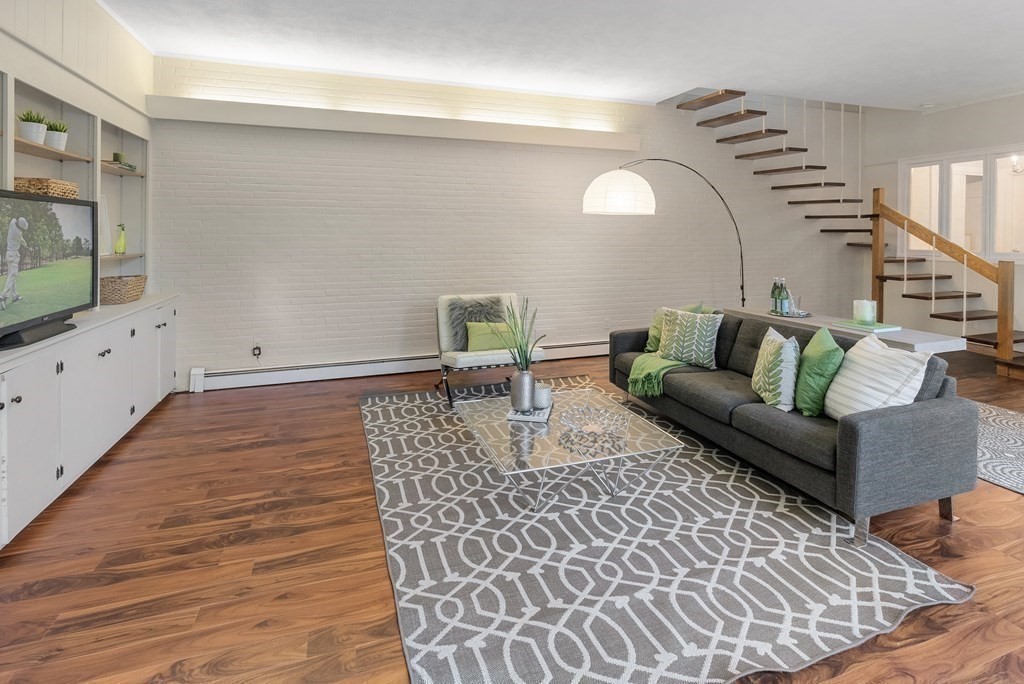 7 Turtle Lane Dover, MA 02030 - Photo 19 of 34 a living room with furniture and wooden floor