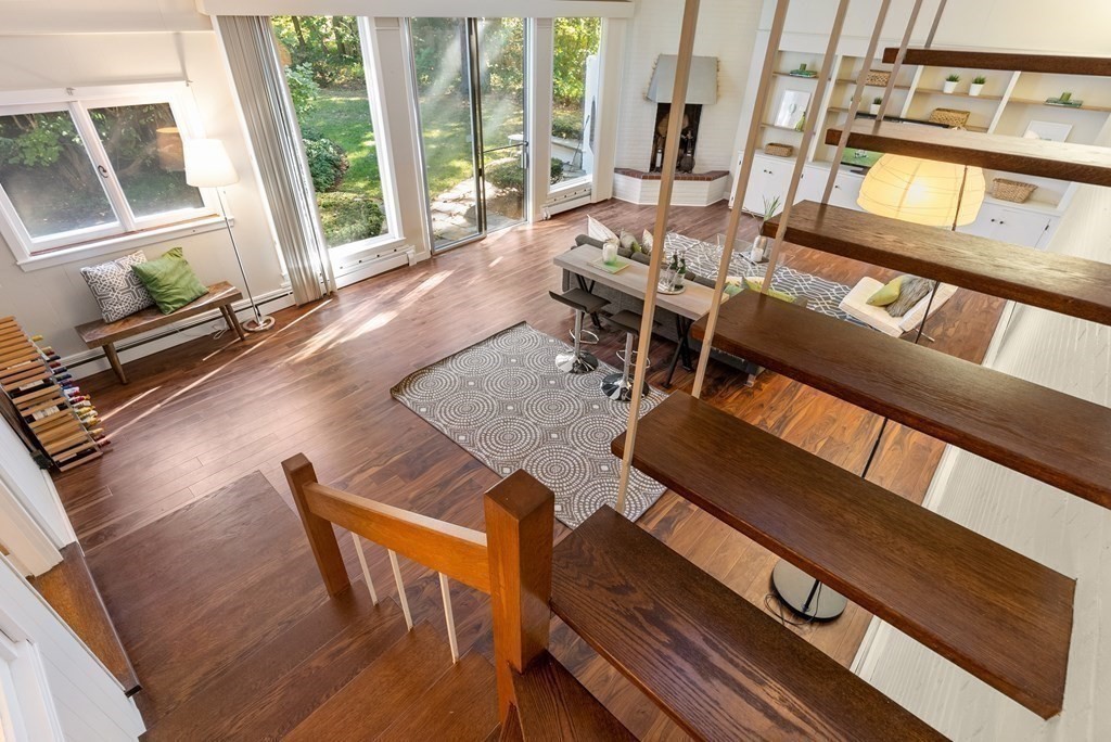 7 Turtle Lane Dover, MA 02030 - Photo 20 of 34 a living room with furniture and a floor to ceiling window