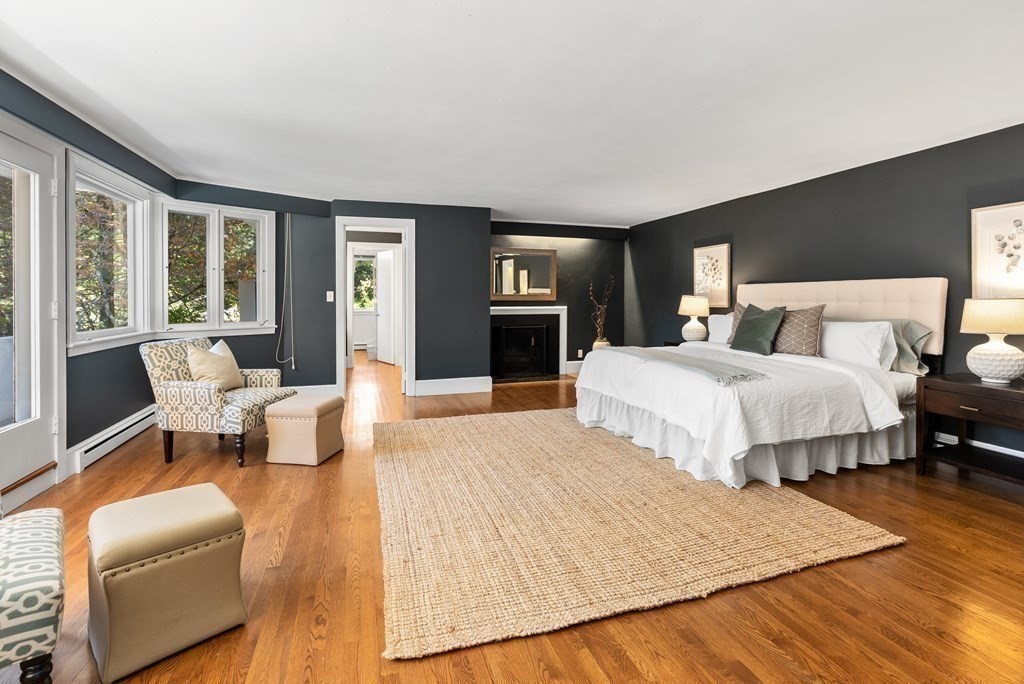 7 Turtle Lane Dover, MA 02030 - Photo 21 of 34 a spacious bedroom with a bed couch and a large window
