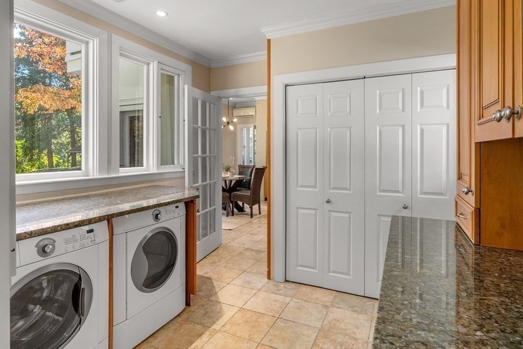 7 Turtle Lane Dover, MA 02030 - Photo 27 of 34 a view of a hallway with washer and dryer