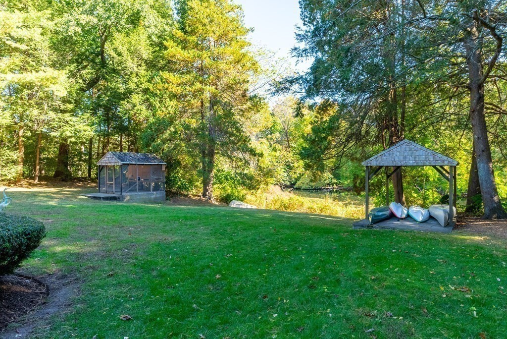 7 Turtle Lane Dover, MA 02030 - Photo 34 of 34 a view of a wooden deck and garden