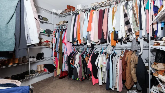 a bedroom with a bed and chandelier