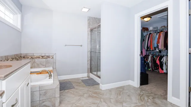 a living room with furniture and a ceiling fan