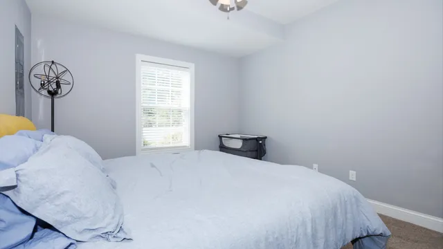 a front view of a house with a large window