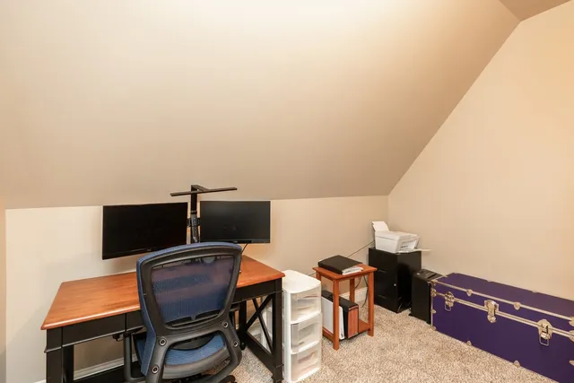 a view of a workspace with furniture