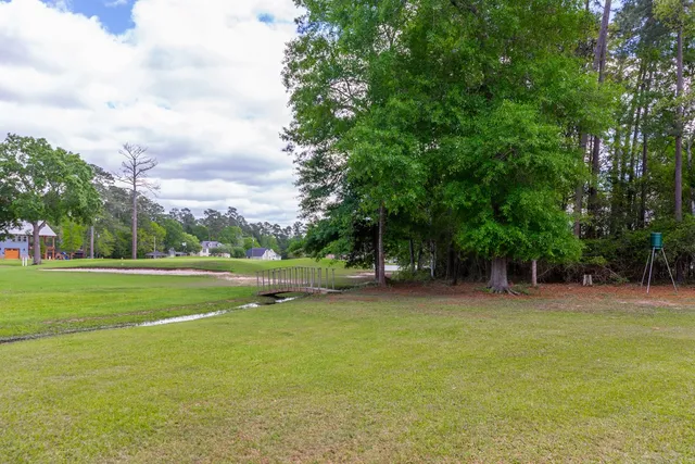 a view of a golf course with a trees