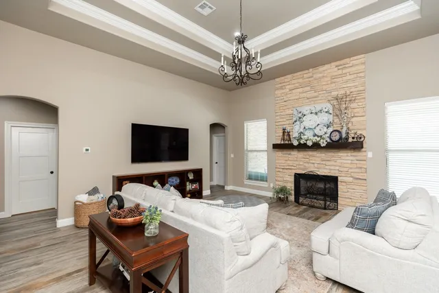 a living room with furniture and a fireplace