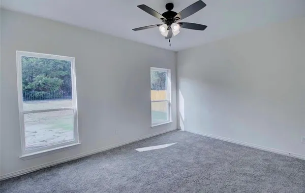 an empty room with a empty space and a window