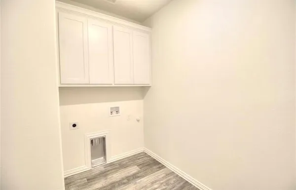 a view of a kitchen with wooden floor