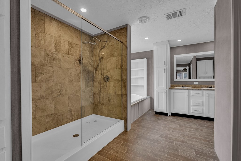 1083 Fanchers Mill Road Sparta, TN 38583 - Photo 18 of 67 a bathroom with a tub a sink a mirror and a shower