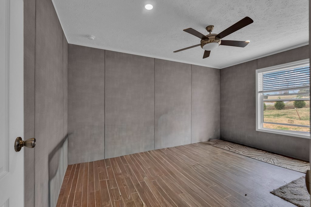 1083 Fanchers Mill Road Sparta, TN 38583 - Photo 27 of 67 a view of a big room with wooden floor closet and windows