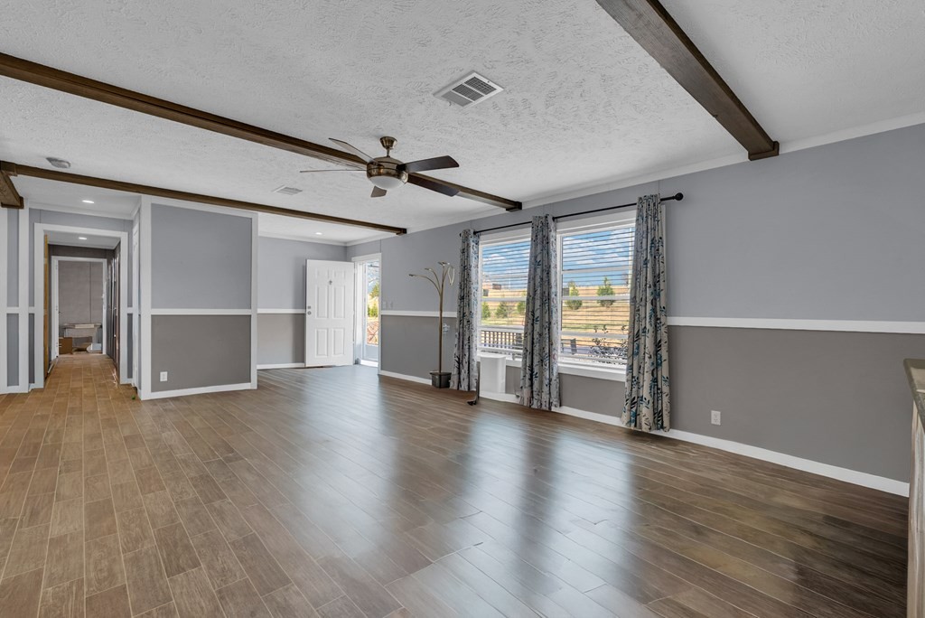 1083 Fanchers Mill Road Sparta, TN 38583 - Photo 4 of 67 a view of an empty room with window and wooden floor