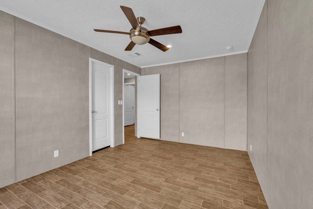 1083 Fanchers Mill Road Sparta, TN 38583 - Photo 42 of 67 a view of a big room with wooden floor and a ceiling fan