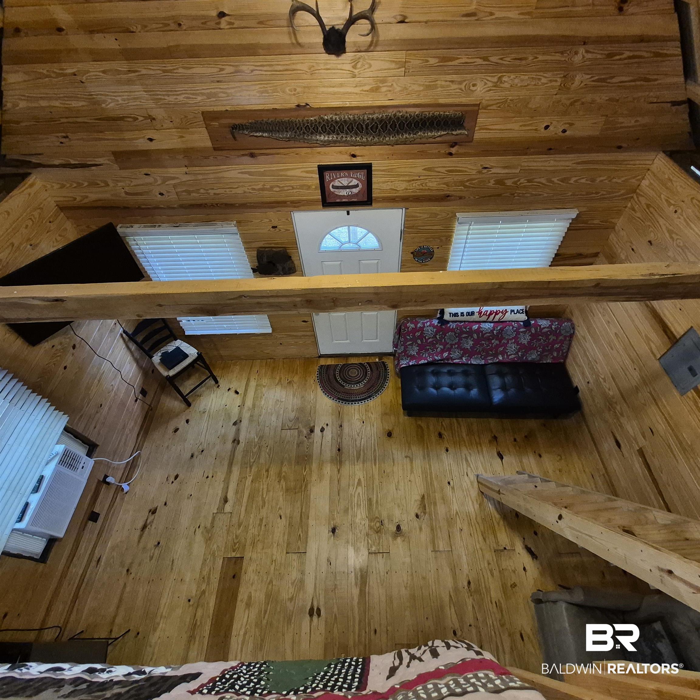 0 Eureka Landing Road Uriah, AL 36480 - Photo 11 of 27 Warm wood-finish flooring throughout, complemented by wood-paneled walls and ceiling