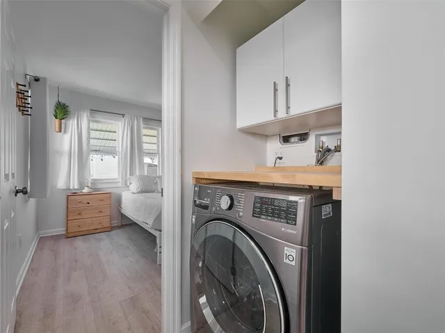 a en suite bathroom with a granite countertop sink
