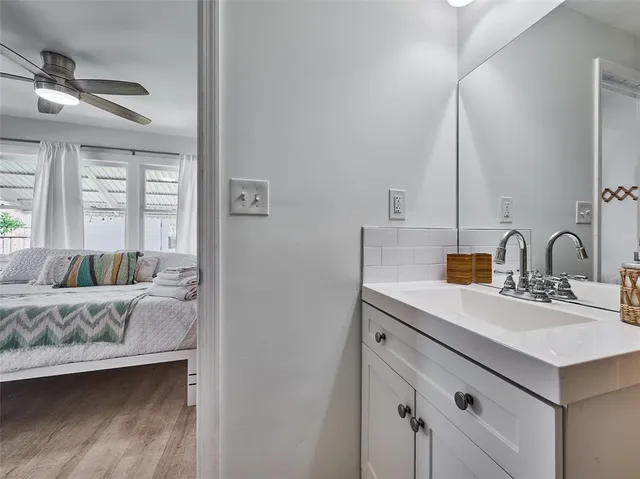 a bedroom with a bed and a couch