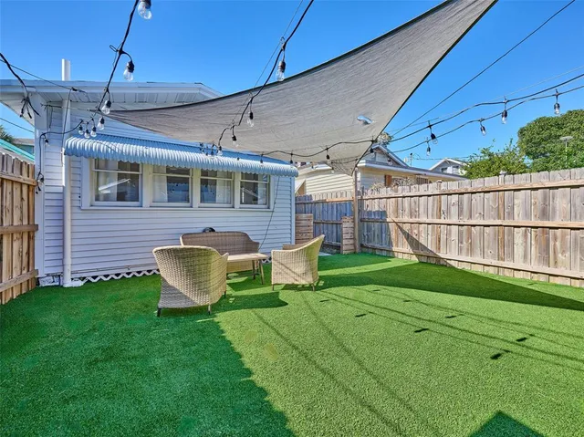 a kitchen with a stove a sink and a refrigerator