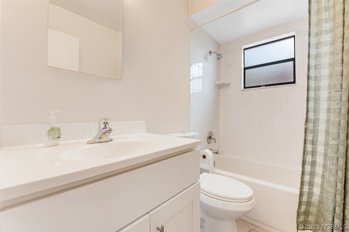 17 Pelican Drive Edgewater, FL 32141 - Photo 15 of 32 a bathroom with a sink a toilet and shower