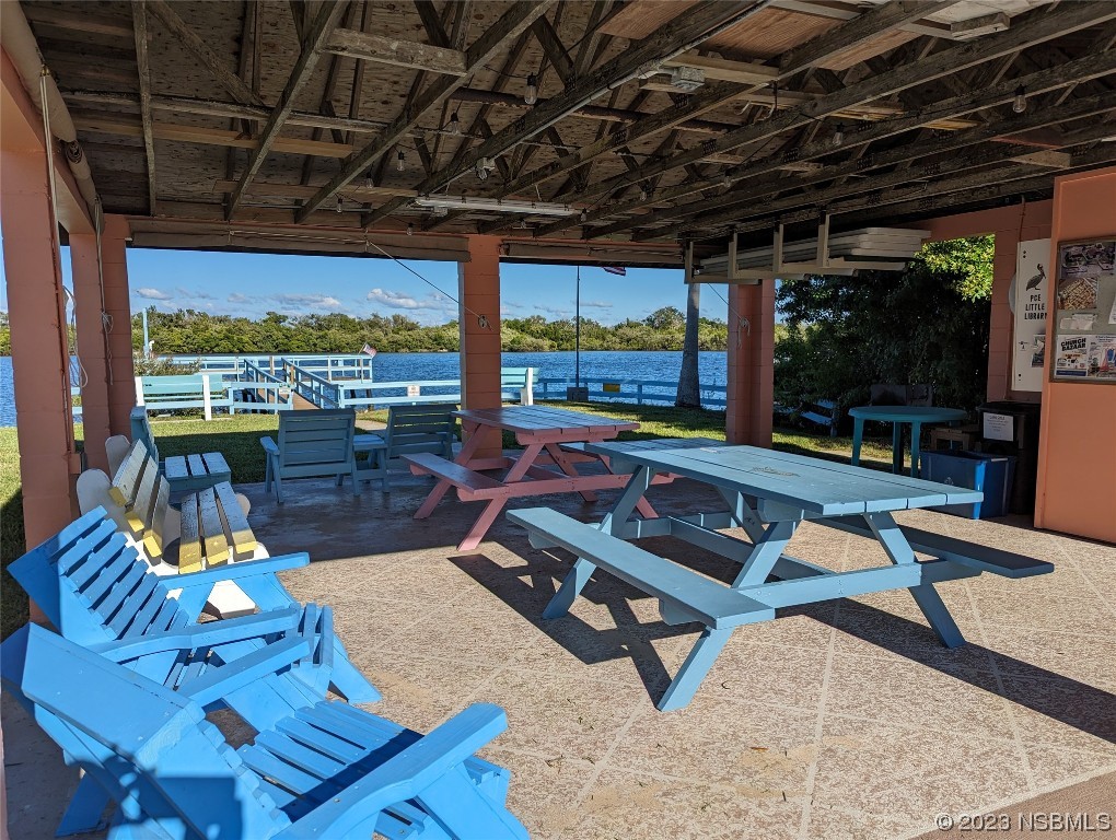 17 Pelican Drive Edgewater, FL 32141 - Photo 24 of 32 a outdoor space with patio lots of furniture and a rug