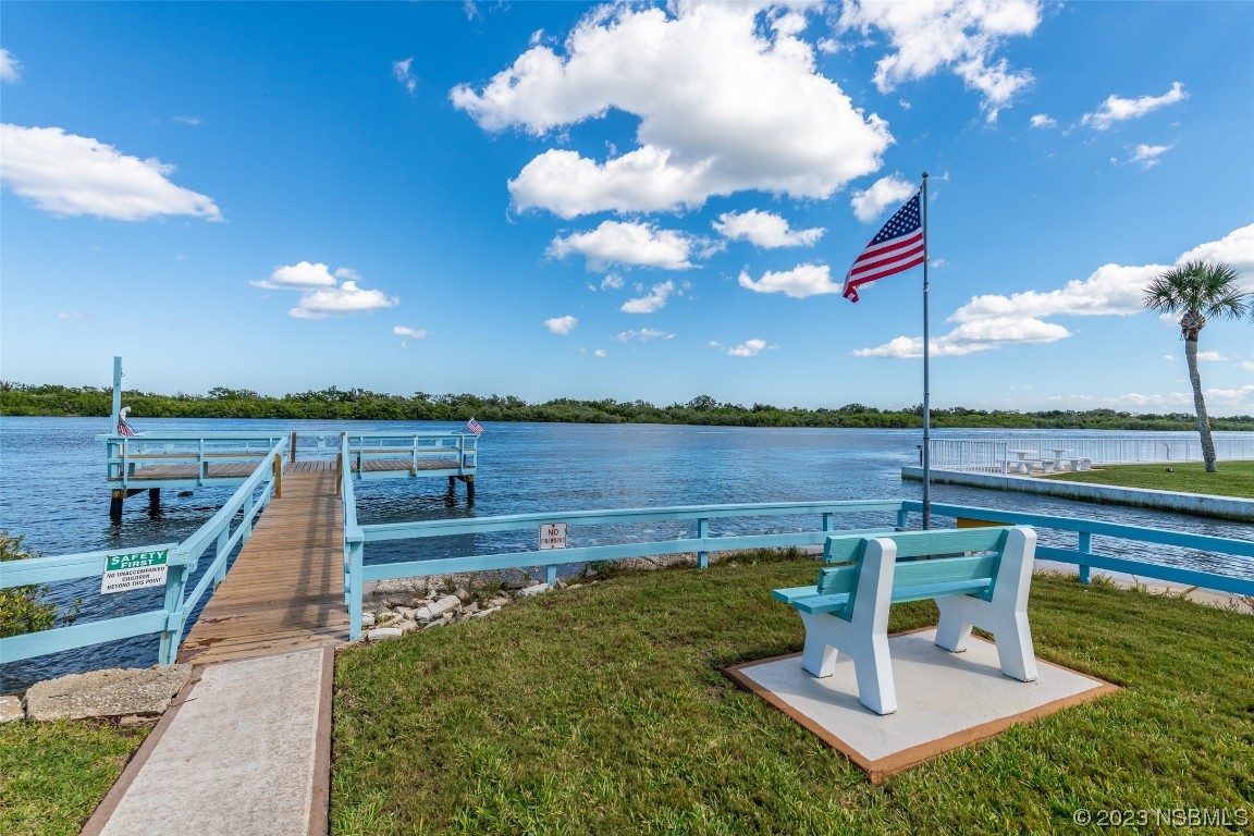 17 Pelican Drive Edgewater, FL 32141 - Photo 27 of 32 a view of a garden with sitting area
