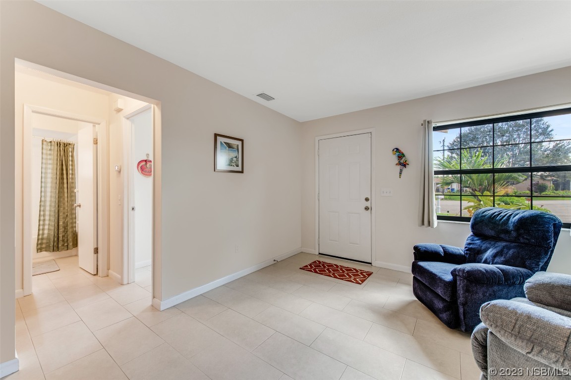 17 Pelican Drive Edgewater, FL 32141 - Photo 5 of 32 a living room with furniture and a window