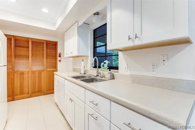 a kitchen with a sink and cabinets