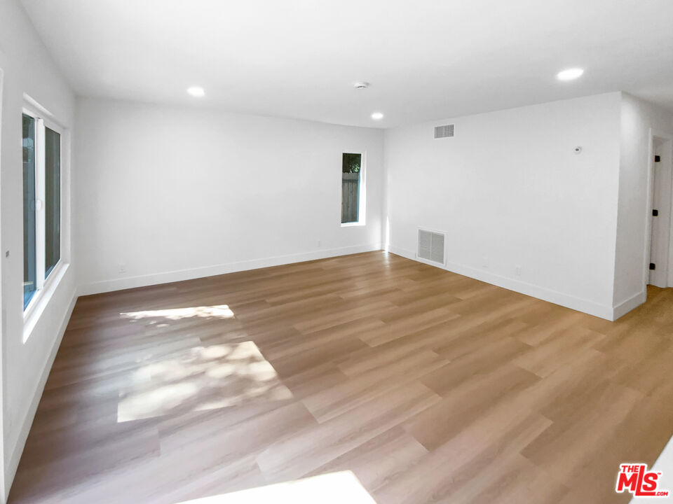 830 Vía Alameda San Dimas, CA 91773 - Photo 15 of 31 a view of an empty room with wooden floor and a window