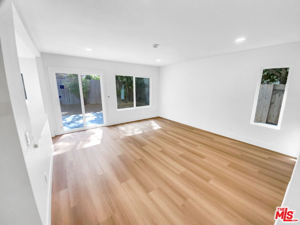 830 Vía Alameda San Dimas, CA 91773 - Photo 16 of 31 a view of an empty room with wooden floor and a window