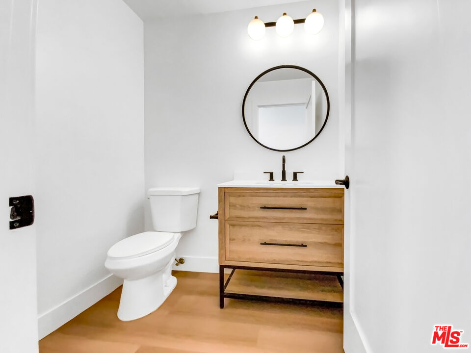 830 Vía Alameda San Dimas, CA 91773 - Photo 17 of 31 a bathroom with a sink toilet and a mirror