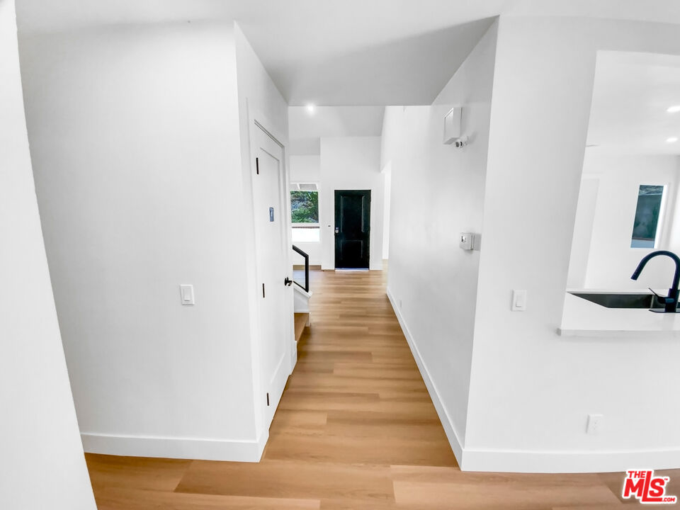 830 Vía Alameda San Dimas, CA 91773 - Photo 18 of 31 a view of a hallway with wooden floor and staircase
