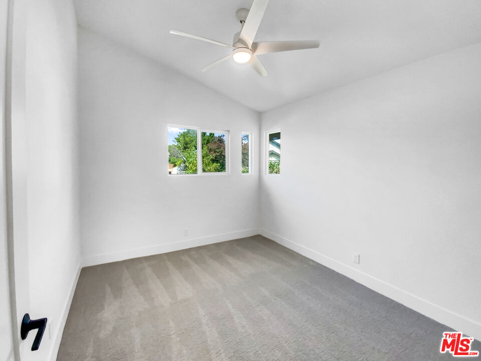 830 Vía Alameda San Dimas, CA 91773 - Photo 21 of 31 an empty room with windows and ceiling fan