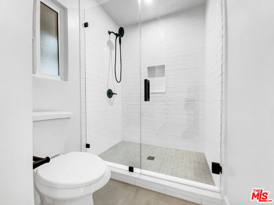 830 Vía Alameda San Dimas, CA 91773 - Photo 6 of 31 a bathroom with a shower and a toilet