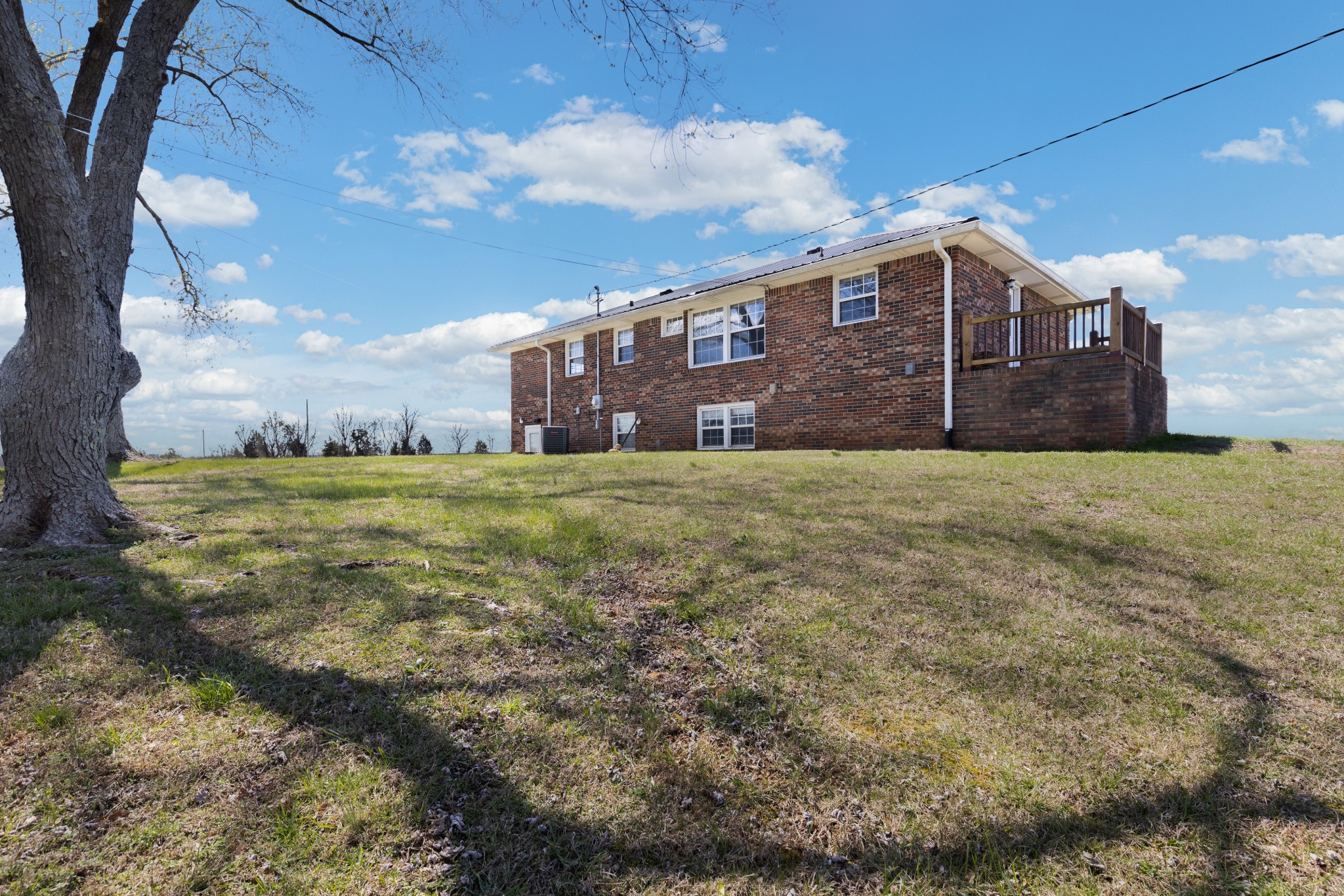 6035 Buzzard Creek Road Cedar Hill, TN 37032 - Photo 3 of 42 a view of a house with a big yard
