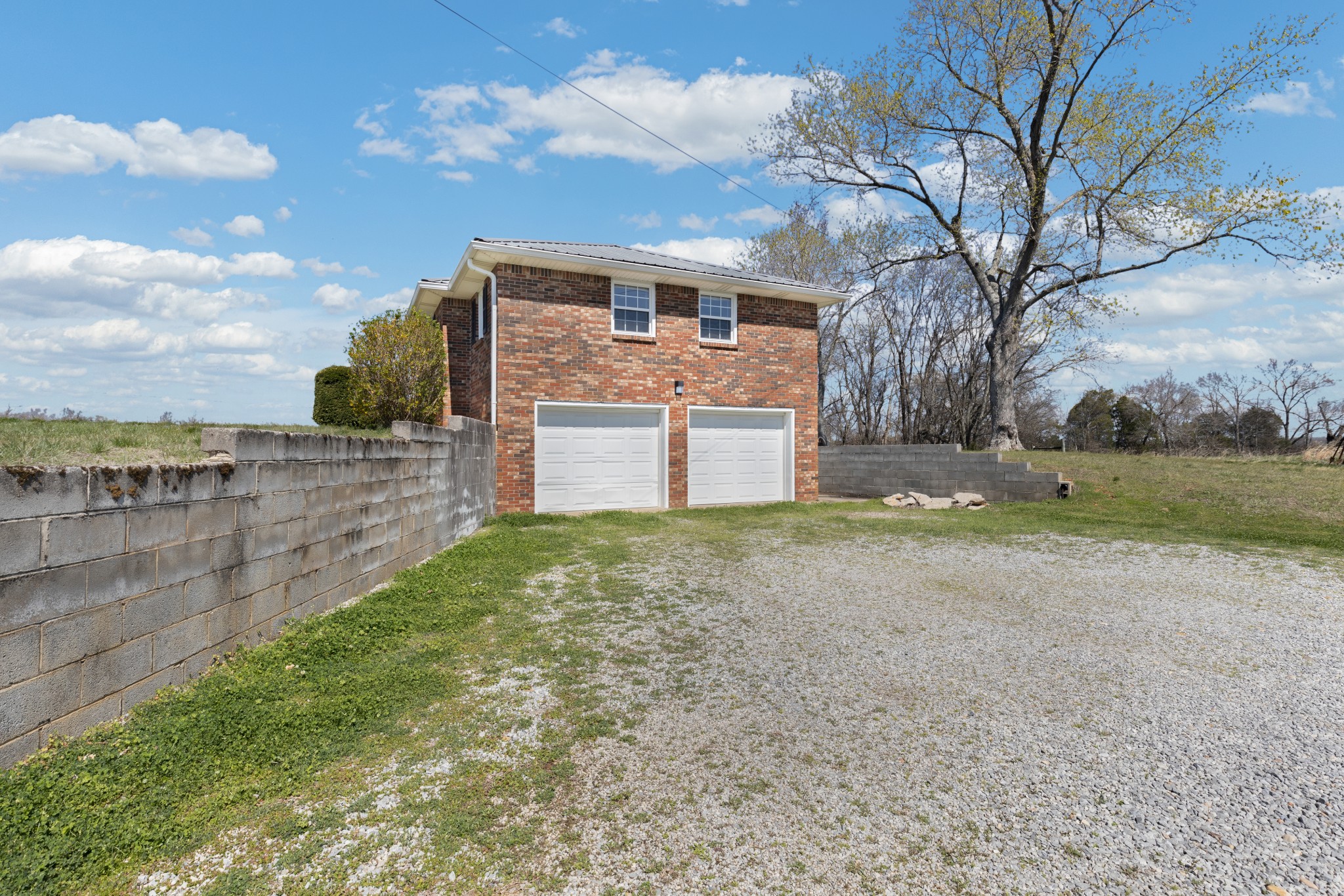 6035 Buzzard Creek Road Cedar Hill, TN 37032 - Photo 4 of 42 a front view of a house with a yard