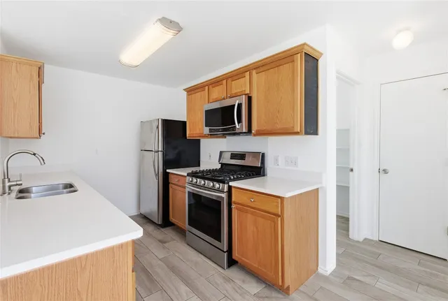 a kitchen with a stove and a microwave